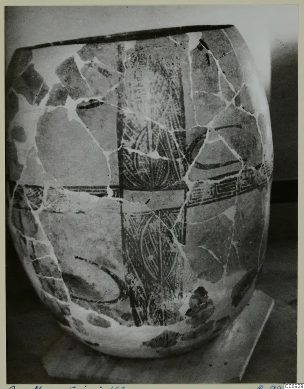 Stone Age pottery vessel from Erimi, broken and mended, with dark painted bands and a vertical patterned panel