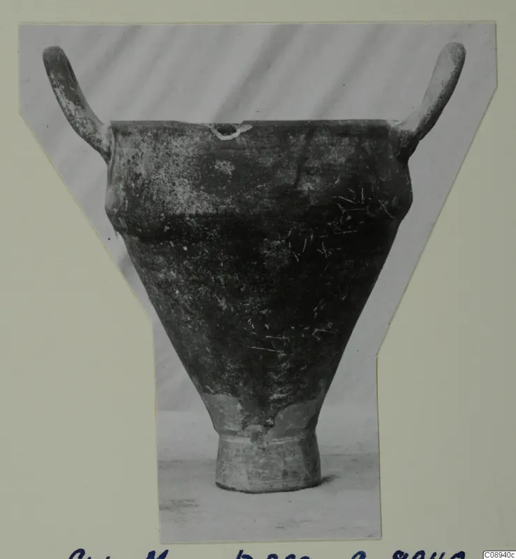 Two-handled pottery vessel with a wide flaring body and ring foot, photographed as a print mounted on a card