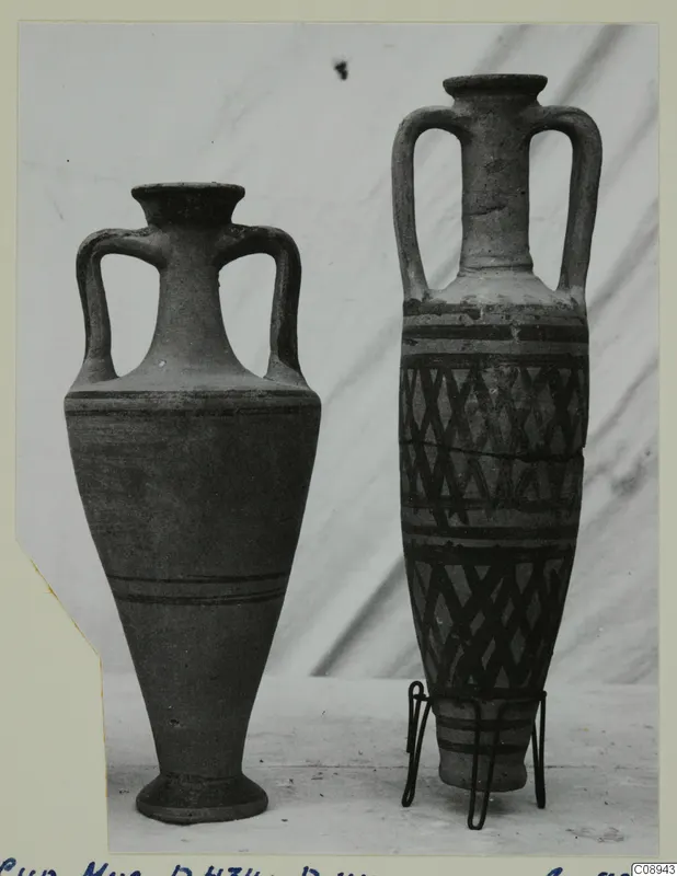 Two two-handled pottery vessels side by side, the right one with a painted lattice and band pattern.