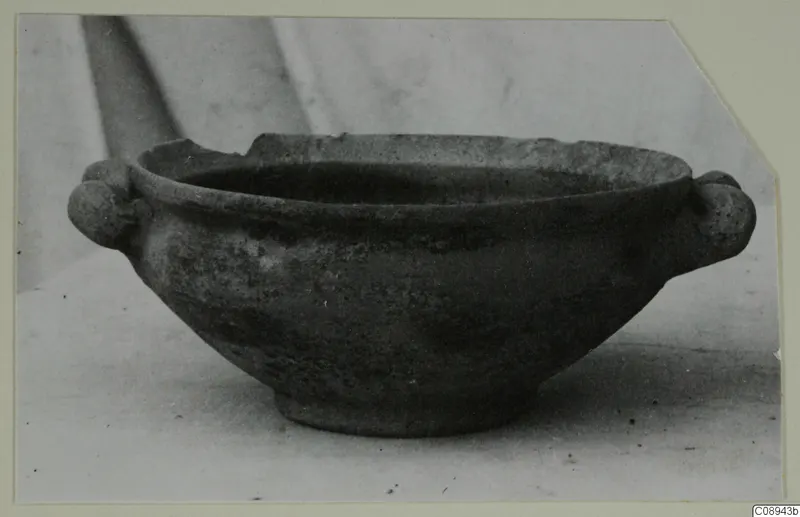Hellenistic bowl with two small knob handles, shown in side view