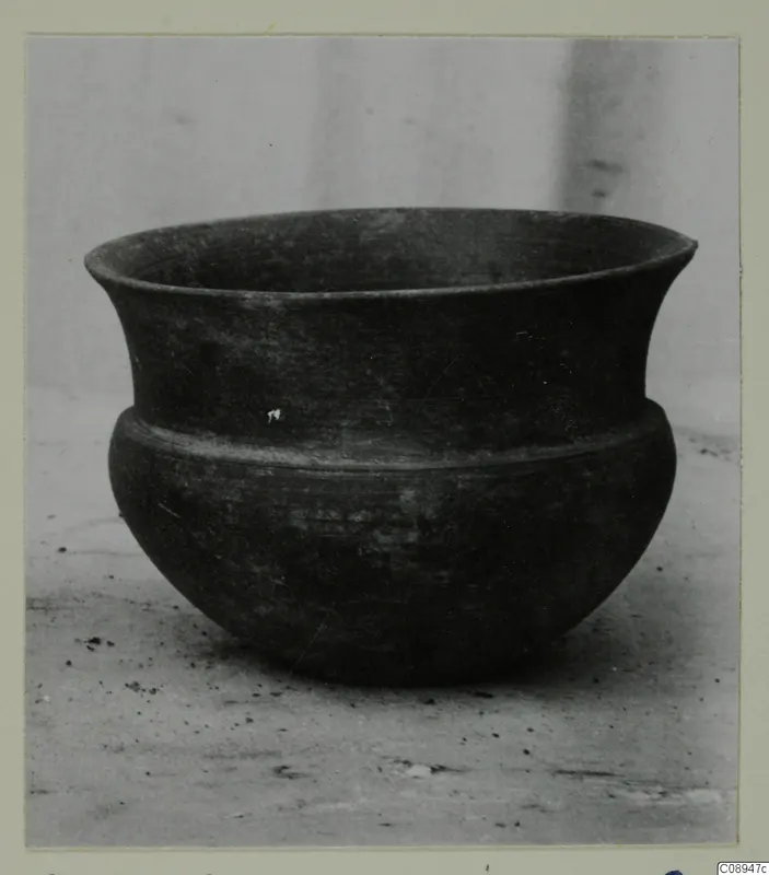 Hellenistic Wares bowl: dark pottery bowl with a flaring rim and a ridge around the shoulder