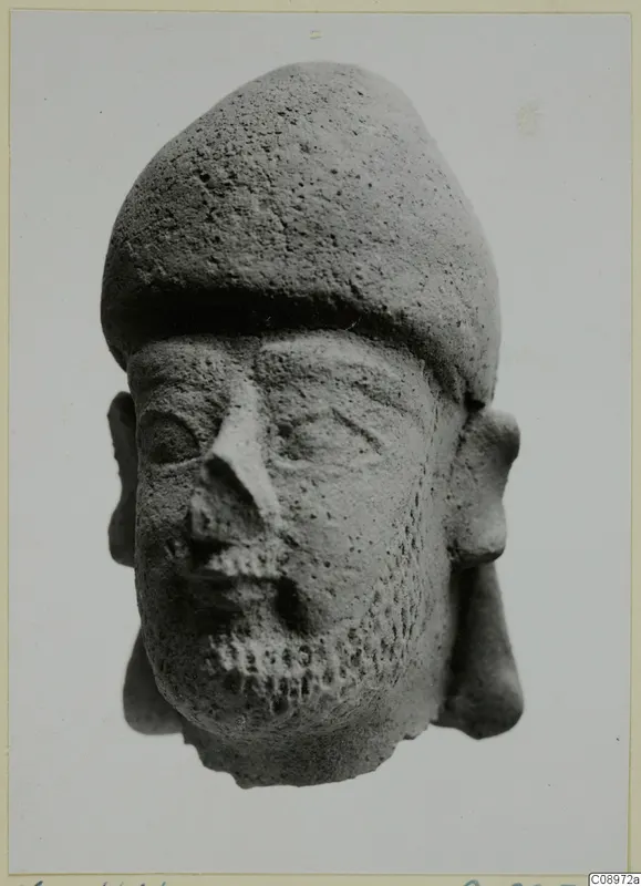 Terracotta head of a bearded figure with a tall cap, from Vasilika