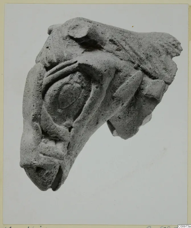 Fragment of a terracotta sculpture showing a rounded eye, a blunt muzzle and ridged shapes, Vasilika 1