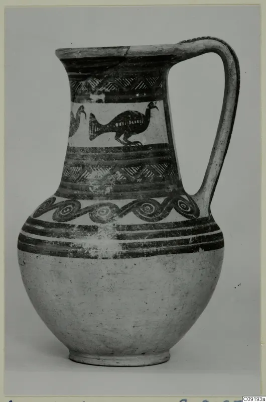 Jug with a strap handle, painted with birds, spirals and dark bands