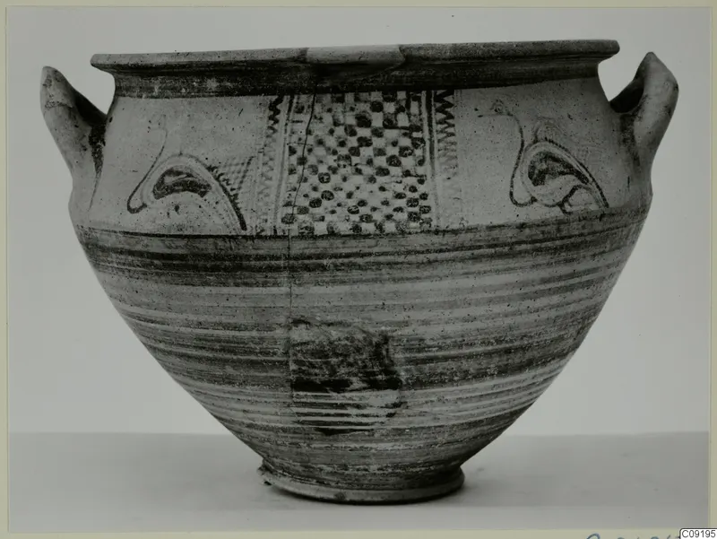 White Painted wheel-made vessel with two handles and dark painted panels of dots, arcs and zigzags