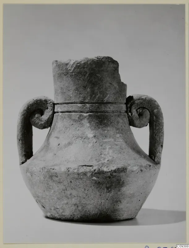 Pot with two spiral handles and a broken neck, photographed against a plain grey backdrop