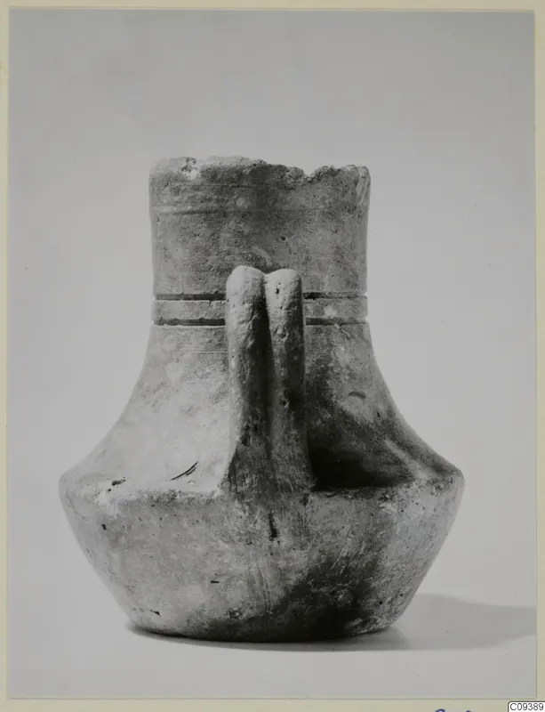Unpainted pottery jar with a wide mouth, two vertical strap handles and two horizontal grooves on the neck.