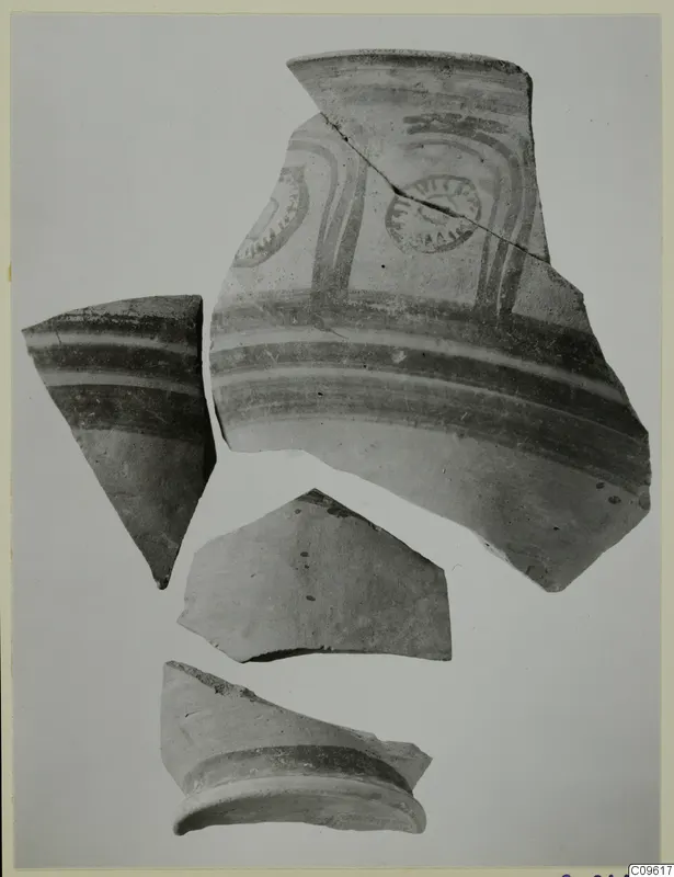 Four pottery sherds, one with painted bands and circular motifs, from the Levanto-Helladic series
