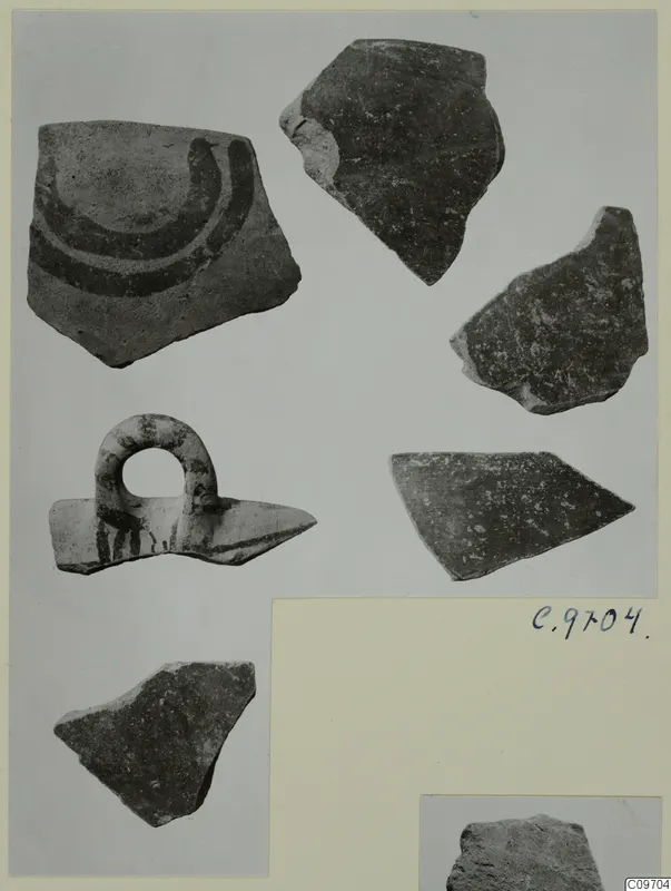 Lev. Hell. sherds: pottery fragments on a mount, one with dark curved bands and one a loop-handle piece with dark painted strokes