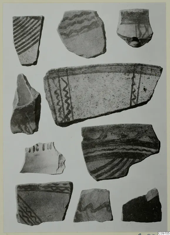 Several painted pottery sherds on a pale card, with dark bands, wavy lines and diagonal hatching. Lev. Hell. sherds