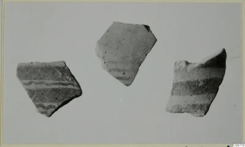 Three painted pottery sherds, Lev. Hell. Sherds, on a plain grey background