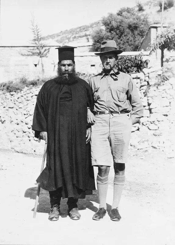 Papa Polivios and Einar Gjerstad standing together in a village street in Mandres, Ayios Iakovos