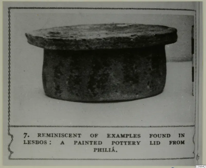 Pottery lid with a broad flat top over a cylindrical body, shown in a photo mount with a printed caption
