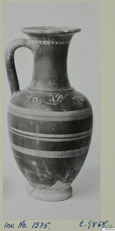 Jar with a single loop handle, white painted bands around the body and a wavy dotted pattern on the shoulder.