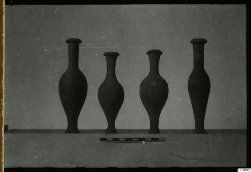Four jugs and vases from Ajii Omologitades, Politiko and Limassol Oasis standing in a row beside a scale bar.