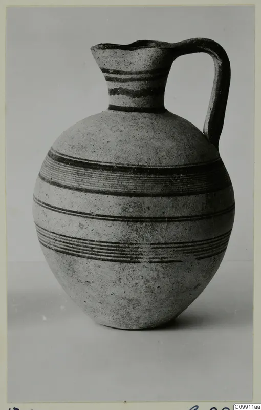 White Painted III-1 jug with a single handle and banded dark painted decoration