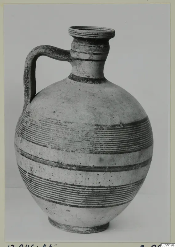 Jug with a single strap handle, a round body and horizontal bands of painted lines
