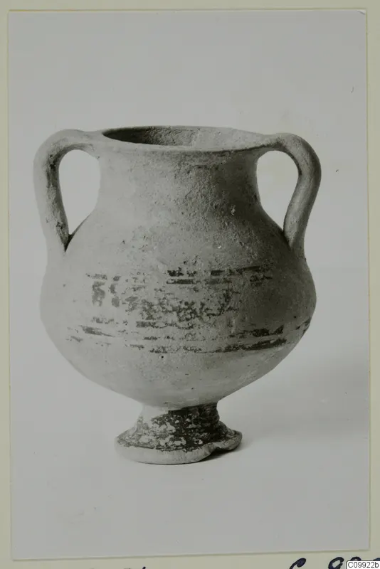 Small two-handled vessel with a ring foot and dark painted bands and strokes on the body