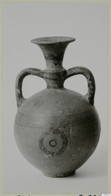 Painted pottery two-handled vessel with a trumpet neck, concentric circles and horizontal bands on the body