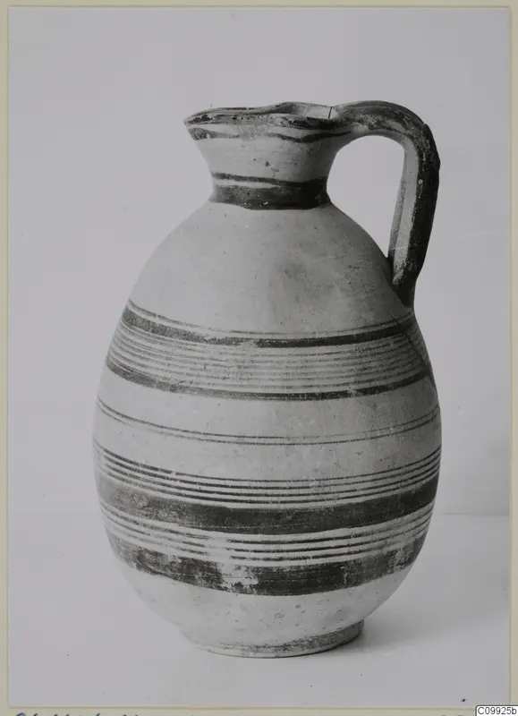 White Painted IV jug with a single loop handle and dark painted bands on a pale body.