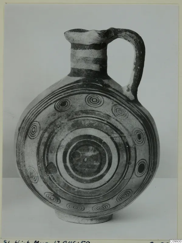 Bichrome IV jug with a looped handle and concentric circle painted decoration