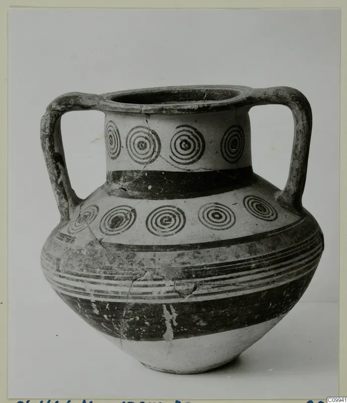 Two-handled pottery vessel with concentric circles on the neck and shoulder and painted bands on the body
