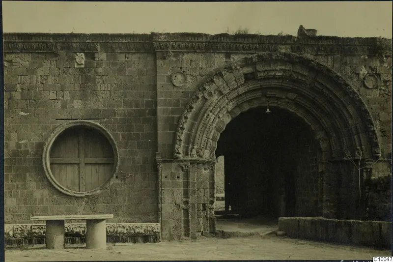 Round-arched entrance in a stone wall with carved arch mouldings, probably at Famagusta