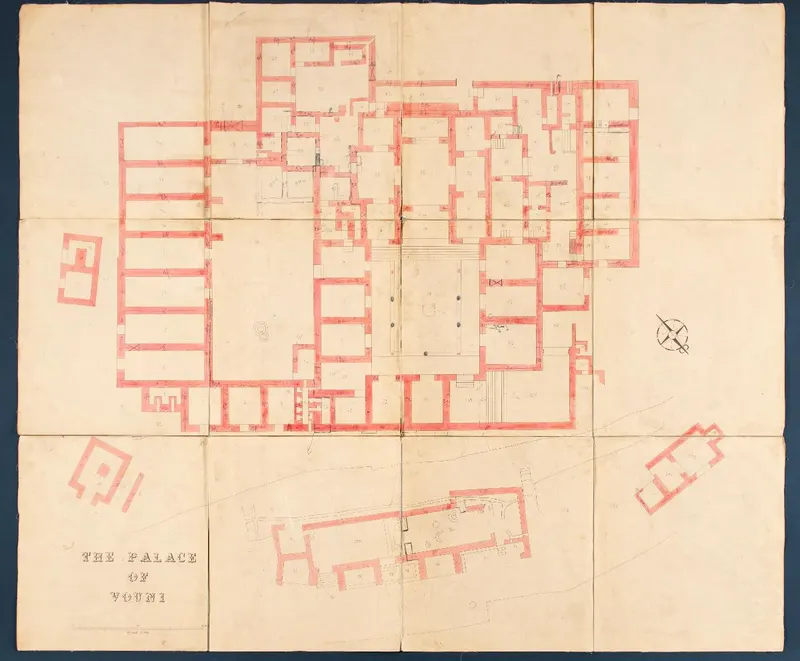 Plan of the palace at Vouni, with red-filled walls, room numbers and a compass rose