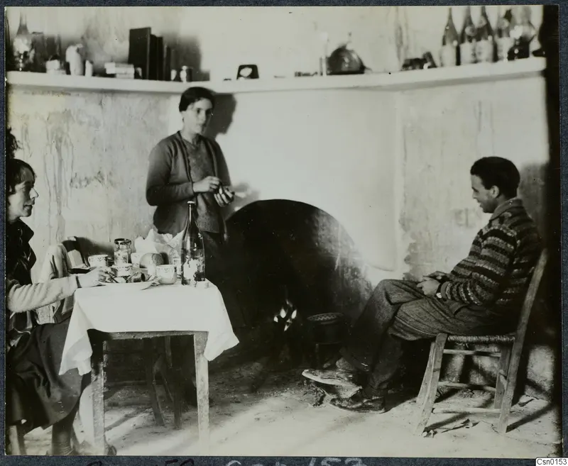 Rosa Lindros, an unknown woman and Erik Sjöqvist in a whitewashed room with a table of cups and bottles