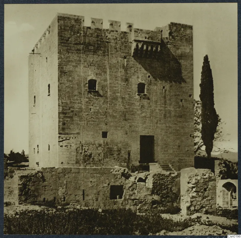 Kolossi castle, a square stone tower with a crenellated top, seen from the front