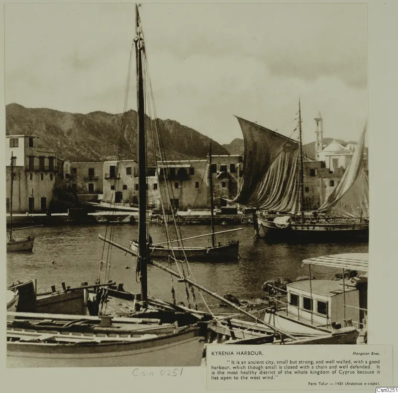 Kyrenia harbour with moored wooden boats, tall masts and whitewashed waterfront houses behind the water