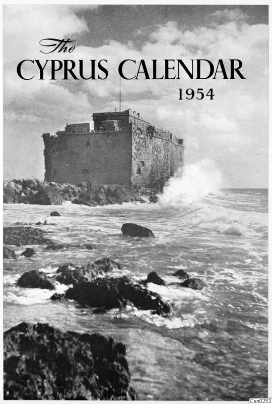 Stone fortification on a rocky outcrop with waves breaking around it, on a printed calendar cover.