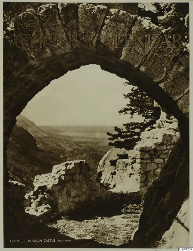 View through a stone arch over a hazy valley, with a tree and ruined walls, on a printed cover