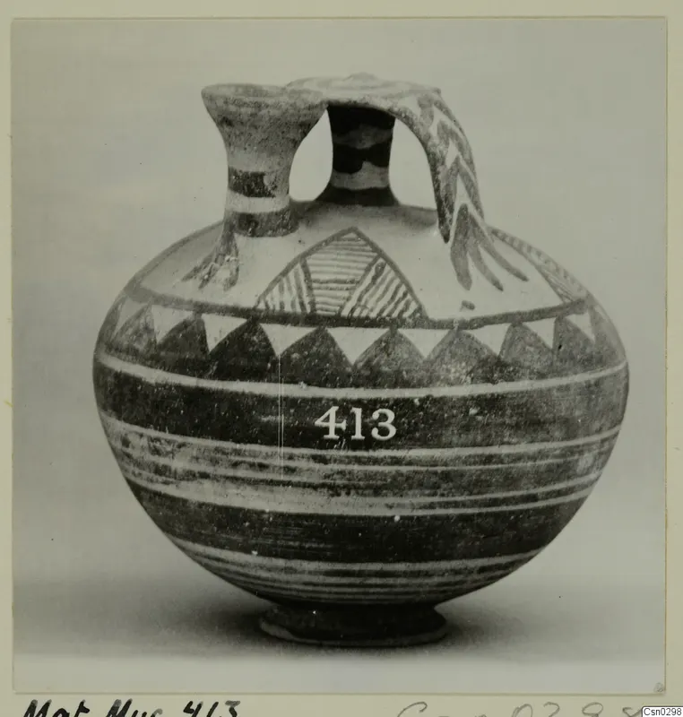 White Painted I jug with a strap handle, dark banded decoration and a row of triangles below the shoulder