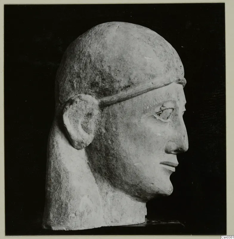 Limestone Neo-Cypriote head in right profile against a black background