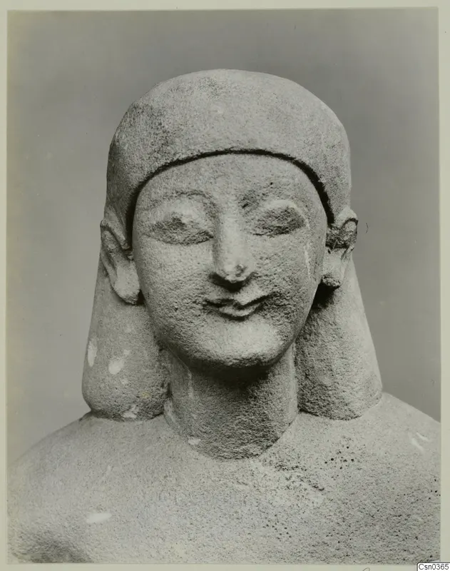 Limestone statue of a head and shoulders, Neo-Cypriote, photographed against a plain grey backdrop
