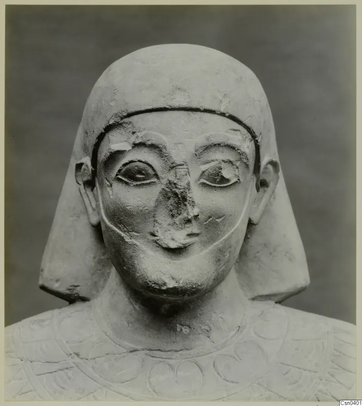 Limestone statue head and shoulders, Proto-Cypriote, face frontal, nose broken