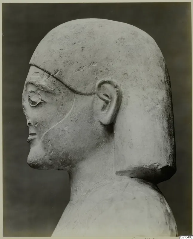 Limestone Proto-Cypriote statue head and shoulders, shown in profile facing left
