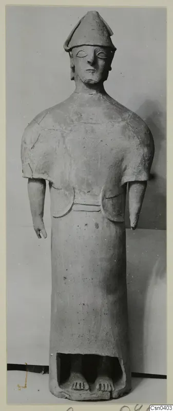 Terracotta Proto-Cypriote I: a standing figure with a tall conical cap and arms hanging at its sides