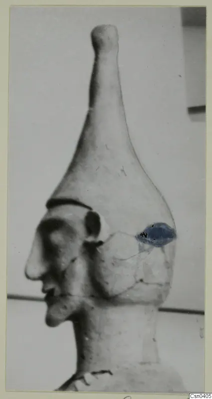 Terracotta Proto-Cypriote I: head and neck of a figure in profile facing left, with a blue patch on the side of the head.