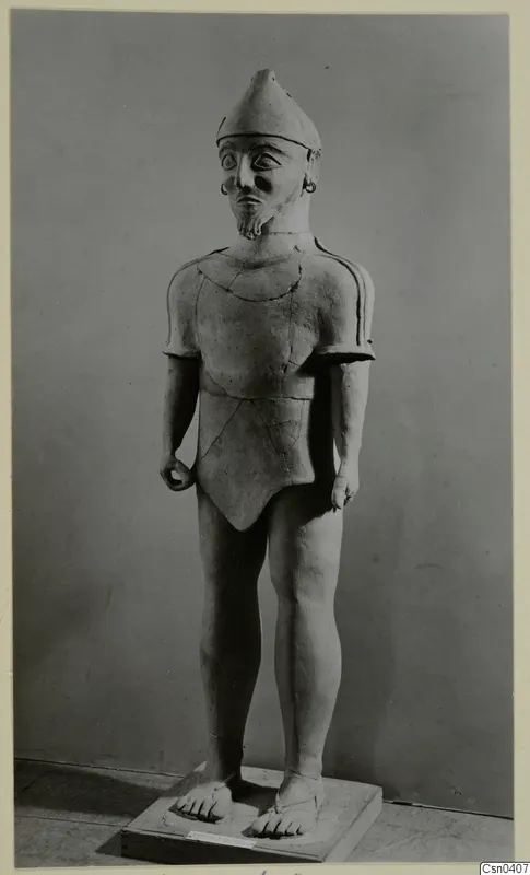 Terracotta figure of a standing bearded male with a conical cap, catalogued as Terracotta Proto-Cypriote I