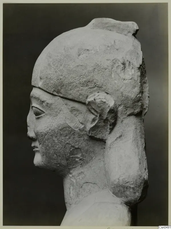 Limestone Neo-Cypriote sculpture of a head in profile, facing left, with a tall headdress
