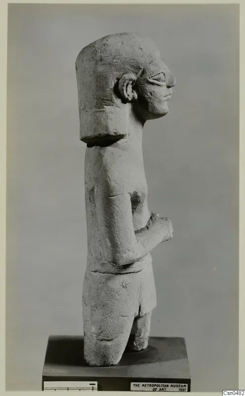 Limestone Neo-Cypriote statue of a standing figure, shown in side view on a wooden base