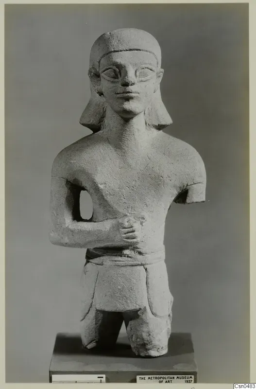 Limestone Neo-Cypriote statue of a human figure with one arm across the chest, on a dark base.
