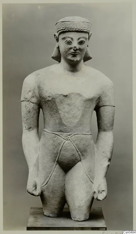Limestone statue of a figure with a headband and cord belt, standing on a square plinth