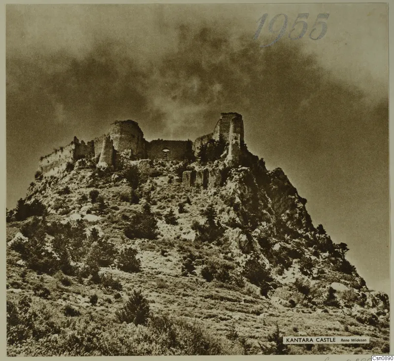Kantara Castle, a ruined stone fortification on a rocky hilltop under a cloudy sky