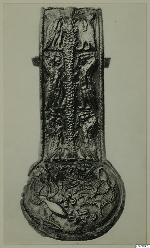 Long-necked metal vessel with relief figures in upright panels and a round base with scroll-like decoration
