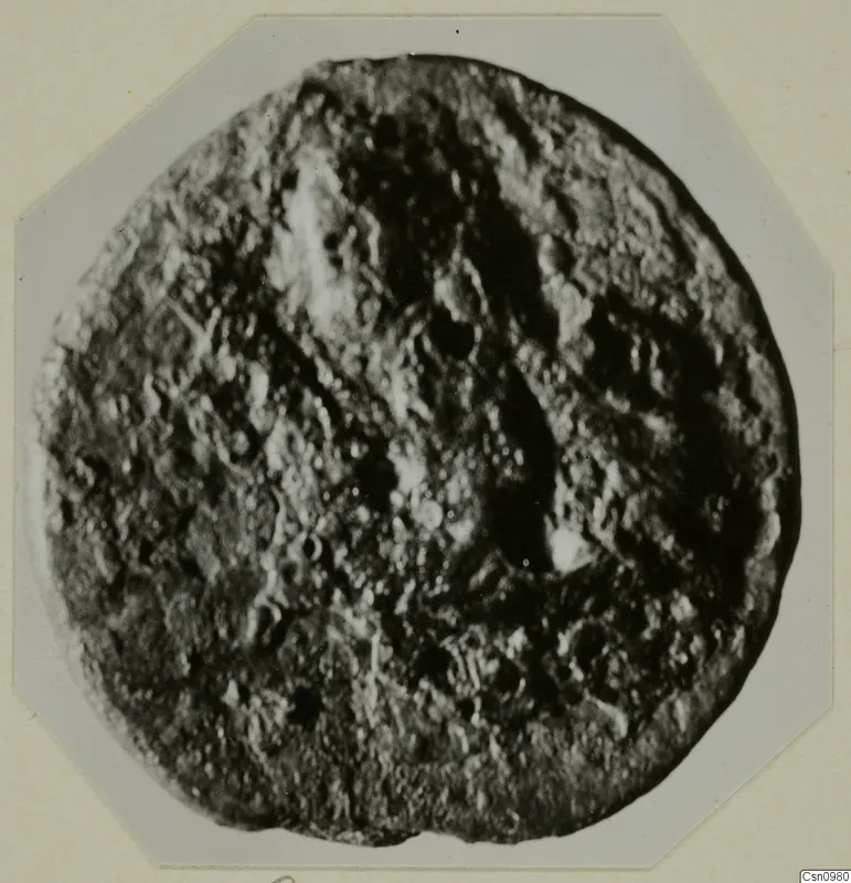 Find from Kountoura Trachonia: a round object with a heavily pitted, uneven surface