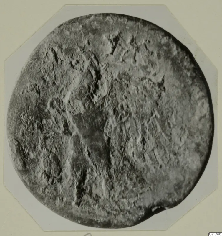 Round, worn find with faint raised markings, from Kountoura Trachonia