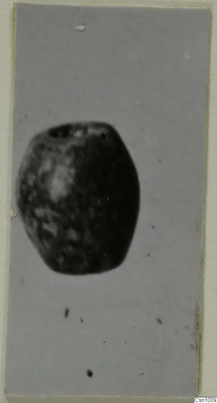 Small barrel-shaped stone object with holes at its top, from the Kastros tombs at Lapithos
